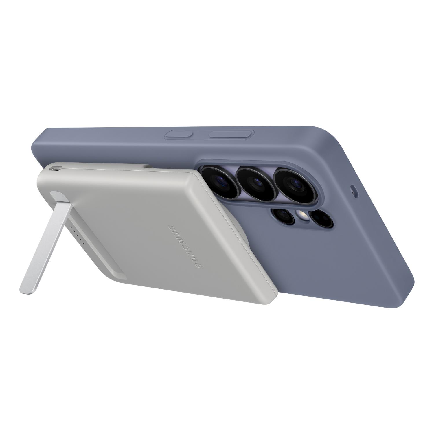 Grey Samsung 5000mAh Qi2 magnetic power bank supporting a smartphone horizontally with the foldable stand extended