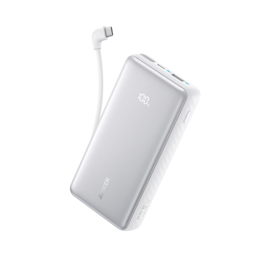 White Anker Zolo 10000mAh 22.5W power bank shown at an angle with the built-in USB-C cable extended and the digital display reading 100%.