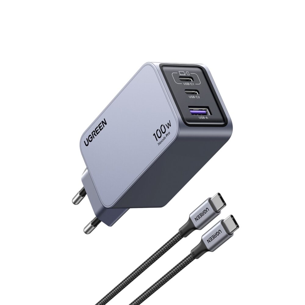 Raised angled view of the grey UGREEN Nexode Pro 100W GaN wall charger with its three charging ports and USB-C to USB-C cable visible.