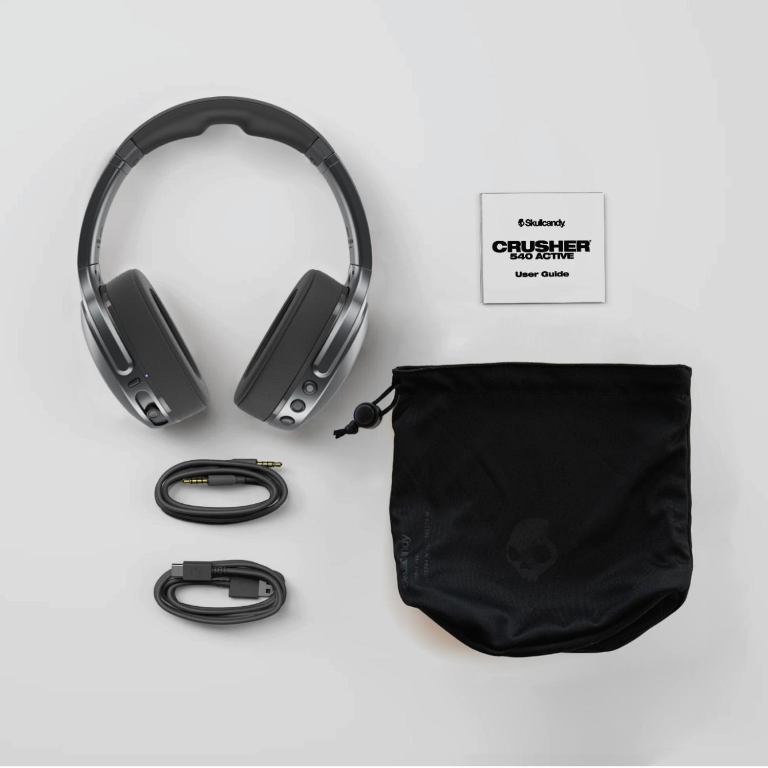 Skullcandy Crusher® 540 Active Smoke headphones shown with the carry pouch, user guide, auxiliary cable and charging cable