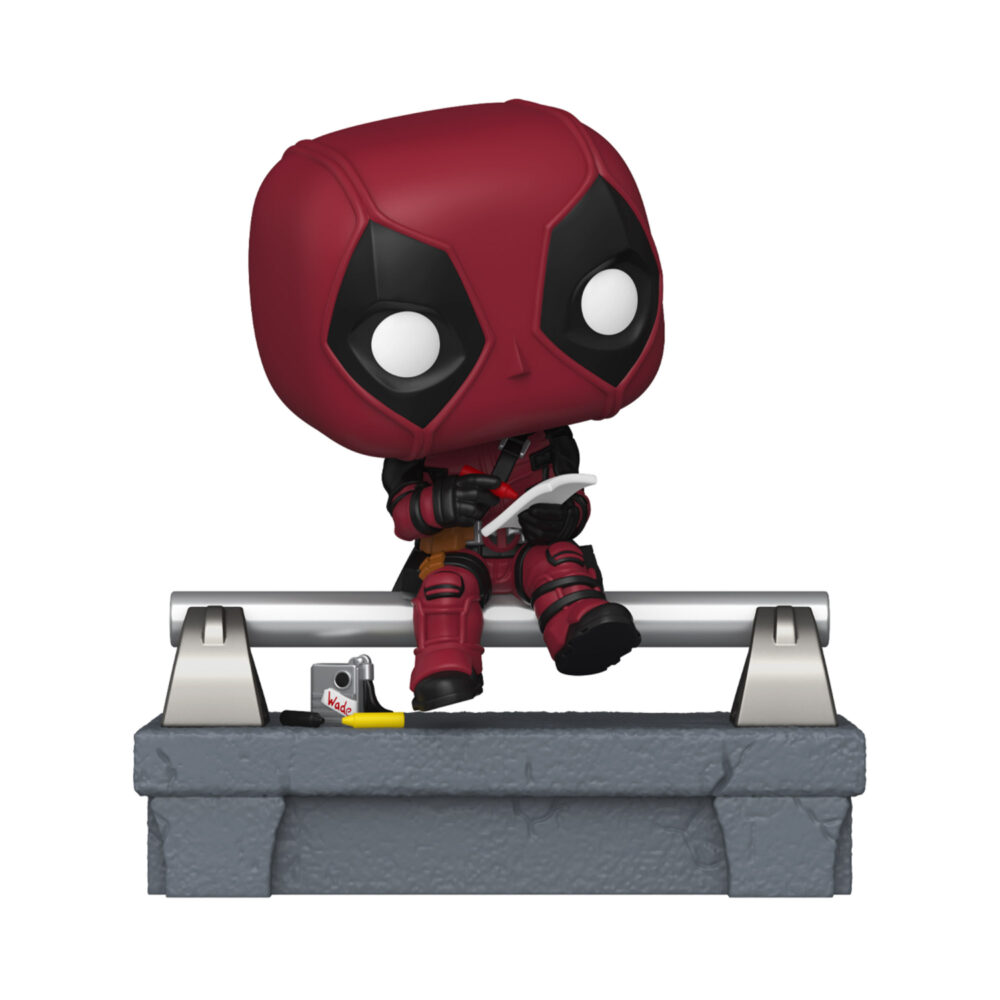 Deadpool Deluxe Funko Pop #1580 seated on a bridge railing while holding a drawing