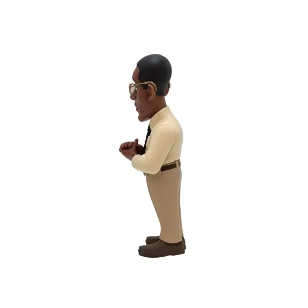 Side view of the Gus Minix Figurine, emphasizing his confident stance and subtle menace.