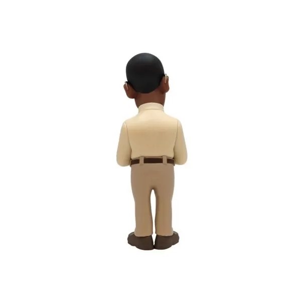 Back view of the Gus Minix Figurine, highlighting his professional outfit and demeanor.