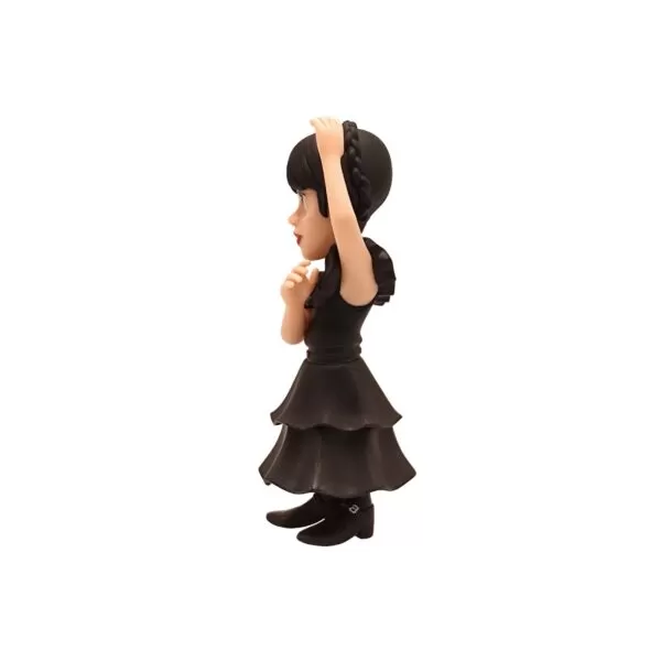 Side view of the Wednesday Addams Minix Figurine, emphasizing her dark and quirky pose.