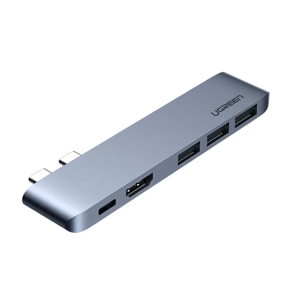 An Apple MacBook Pro 2020, MacBook Pro 2019, MacBook Pro 2018, MacBook Pro 2017, MacBook Pro 2016, MacBook Air 2020, MacBook Air 2019, or MacBook Air 2018 Silver UGREEN 5 Port USB Type C Multifunction Hub.